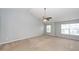 Bright bedroom with neutral walls, carpeted floors, a vaulted ceiling and dual windows at 228 Donatella Dr, Goose Creek, SC 29445