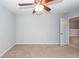 Spacious bedroom boasts neutral walls, a ceiling fan, and a doorway to another room at 228 Donatella Dr, Goose Creek, SC 29445