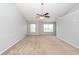 Spacious bedroom featuring two large windows and neutral carpet at 228 Donatella Dr, Goose Creek, SC 29445