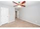 Spacious bedroom features plush carpet, a ceiling fan, and a doorway at 228 Donatella Dr, Goose Creek, SC 29445