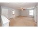 Large bonus room with neutral carpet, ceiling fan, and lots of light at 228 Donatella Dr, Goose Creek, SC 29445