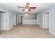 Bonus room with plush carpet, ceiling fan, and abundant natural light at 228 Donatella Dr, Goose Creek, SC 29445