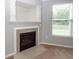 Cozy fireplace with decorative mantle and a large window, adding warmth and charm at 228 Donatella Dr, Goose Creek, SC 29445