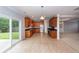 Spacious kitchen boasts ample wood cabinetry, stainless steel appliances, and flows into the adjacent living area at 228 Donatella Dr, Goose Creek, SC 29445