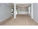 Spacious living room showcasing open floor plan, neutral carpet, pillars, and ample natural light at 228 Donatella Dr, Goose Creek, SC 29445