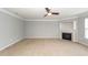 Spacious living room boasts neutral paint, modern ceiling fan, and cozy fireplace at 228 Donatella Dr, Goose Creek, SC 29445