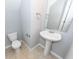 Stylish powder room with pedestal sink, a mirror and tiled flooring at 228 Donatella Dr, Goose Creek, SC 29445