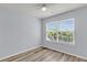 Bright bedroom with a large window providing natural light and a view of the outdoors at 230 Darcy Ave, Goose Creek, SC 29445