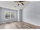 Inviting bedroom has natural light and vaulted ceilings with hardwood floors at 230 Darcy Ave, Goose Creek, SC 29445