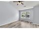 Bright bedroom with hardwood floors and ample natural light from the large window at 230 Darcy Ave, Goose Creek, SC 29445