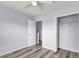 Light filled bedroom with a ceiling fan and access to the bathroom and closet at 230 Darcy Ave, Goose Creek, SC 29445