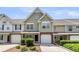 Inviting townhouse with a single-car garage and well-manicured landscaping at 230 Darcy Ave, Goose Creek, SC 29445