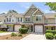 Charming townhouse featuring a single-car garage, complemented by attractive landscaping and excellent curb appeal at 230 Darcy Ave, Goose Creek, SC 29445