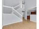 Charming foyer offers a staircase with white banisters and partial view of the kitchen at 230 Darcy Ave, Goose Creek, SC 29445