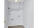 Compact laundry room with installed shelving and modern vinyl flooring at 230 Darcy Ave, Goose Creek, SC 29445