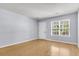 Bright living room with hardwood floors and view of backyard at 230 Darcy Ave, Goose Creek, SC 29445