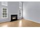 Spacious living room with a fireplace, hardwood floors and many windows at 230 Darcy Ave, Goose Creek, SC 29445