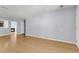 Spacious living room boasts hardwood floors, neutral paint, and a view into the kitchen at 230 Darcy Ave, Goose Creek, SC 29445