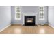 Living room featuring a fireplace, hardwood floors and lots of natural light at 230 Darcy Ave, Goose Creek, SC 29445