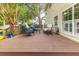 A well-maintained back deck with outdoor seating and views of the private, fenced-in yard at 261 Mossy Oak Way, Mount Pleasant, SC 29464