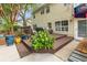 Multi-level back deck perfect for entertaining, with lush plants and easy access to the backyard at 261 Mossy Oak Way, Mount Pleasant, SC 29464