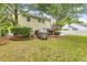 Expansive backyard with mature trees, a playhouse, a back deck and patio area at 261 Mossy Oak Way, Mount Pleasant, SC 29464