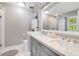 Beautiful bathroom featuring a double sink vanity, white cabinets, and ample lighting at 261 Mossy Oak Way, Mount Pleasant, SC 29464