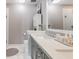 Bright bathroom featuring a double sink vanity, white cabinets, and a soaking tub at 261 Mossy Oak Way, Mount Pleasant, SC 29464