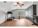 A bonus room with an exercise area, built in storage cabinets, desk space and laminate flooring at 261 Mossy Oak Way, Mount Pleasant, SC 29464