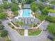 Aerial view of a large community pool and tennis court with beautiful landscaping and surrounding residences at 261 Mossy Oak Way, Mount Pleasant, SC 29464