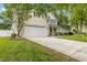 Charming two-story home with a well-manicured front yard and a two-car garage at 261 Mossy Oak Way, Mount Pleasant, SC 29464