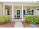 Charming front porch adorned with decorative plants and flowers creating a welcoming entrance at 261 Mossy Oak Way, Mount Pleasant, SC 29464