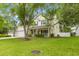 Inviting two-story home featuring a well-manicured lawn and mature trees creating a warm curb appeal at 261 Mossy Oak Way, Mount Pleasant, SC 29464