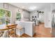 Well-lit kitchen with stainless steel appliances, white countertops, and breakfast bar at 261 Mossy Oak Way, Mount Pleasant, SC 29464