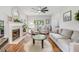 Cozy living room with fireplace, ceiling fan, and neutral furniture, perfect for relaxing at 261 Mossy Oak Way, Mount Pleasant, SC 29464