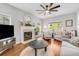 Bright living room featuring fireplace, ceiling fan, light gray walls, and comfortable seating at 261 Mossy Oak Way, Mount Pleasant, SC 29464