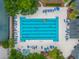 Aerial view of a large pool with plenty of lounge chairs and a tennis court nearby at 261 Mossy Oak Way, Mount Pleasant, SC 29464