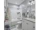 Bright, white bathroom featuring a shower-tub combo and modern vanity with ample counter space at 2632 Egret Crest Ln, Charleston, SC 29414