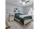 Cozy bedroom with a full size bed, ceiling fan, window seat and plenty of natural light at 2632 Egret Crest Ln, Charleston, SC 29414