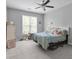 Bedroom filled with natural light and featuring neutral carpeting and a view of mature trees at 2632 Egret Crest Ln, Charleston, SC 29414