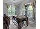 Inviting dining room with abundant natural light and cozy seating for four at 2632 Egret Crest Ln, Charleston, SC 29414
