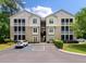 Well-maintained condo building with a tan exterior and spacious screened balconies at 2632 Egret Crest Ln, Charleston, SC 29414