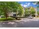 Beautiful condo complex featuring manicured lawns, lush landscaping, ample parking and screened in porches at 2632 Egret Crest Ln, Charleston, SC 29414