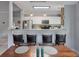 Open concept kitchen with bar seating, white cabinetry, modern appliances and view of adjacent dining area at 2632 Egret Crest Ln, Charleston, SC 29414