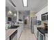 Contemporary kitchen equipped with stainless steel appliances and bright white cabinetry at 2632 Egret Crest Ln, Charleston, SC 29414