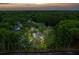 Aerial view of the property nestled among lush trees with rooftops of surrounding homes visible at 2900 Split Hickory Ct, Johns Island, SC 29455