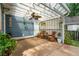 Inviting back patio with pergola cover, ceiling fan, wicker furniture, and access door at 2900 Split Hickory Ct, Johns Island, SC 29455