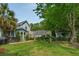Expansive backyard featuring a well-manicured lawn and a charming patio area at 2900 Split Hickory Ct, Johns Island, SC 29455