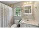 Bathroom with shower/tub combination, white vanity, and window providing natural light at 2900 Split Hickory Ct, Johns Island, SC 29455