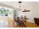 This dining area features hardwood floors, modern lighting, and unique decorative shelving at 2900 Split Hickory Ct, Johns Island, SC 29455
